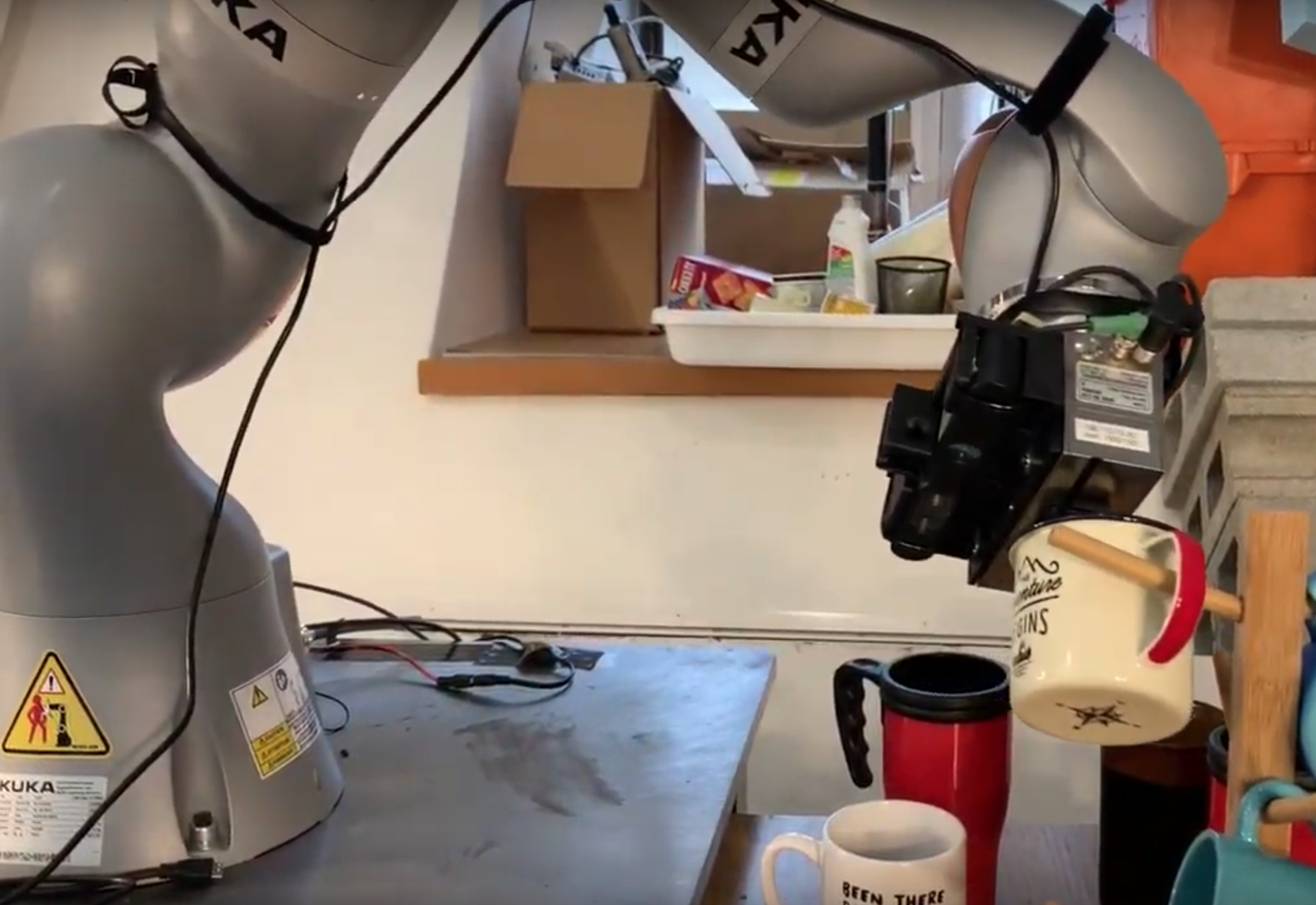 Robot hanging mug by hook
