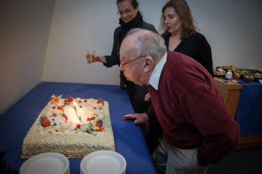 Professor Emeritus Fano blows out the candles with CSAIL Director Daniela Rus (right) and Event Coordinator Victoria Palay.

<br /><br />
photo by Jason Dorfman, MIT CSAIL
