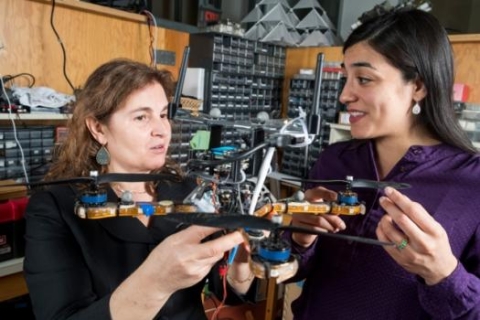 Researchers including MIT professor Daniela Rus (left) and research scientist Stephanie Gil (right) have developed a technique for preventing malicious hackers from commandeering robot teams’ communication networks. 