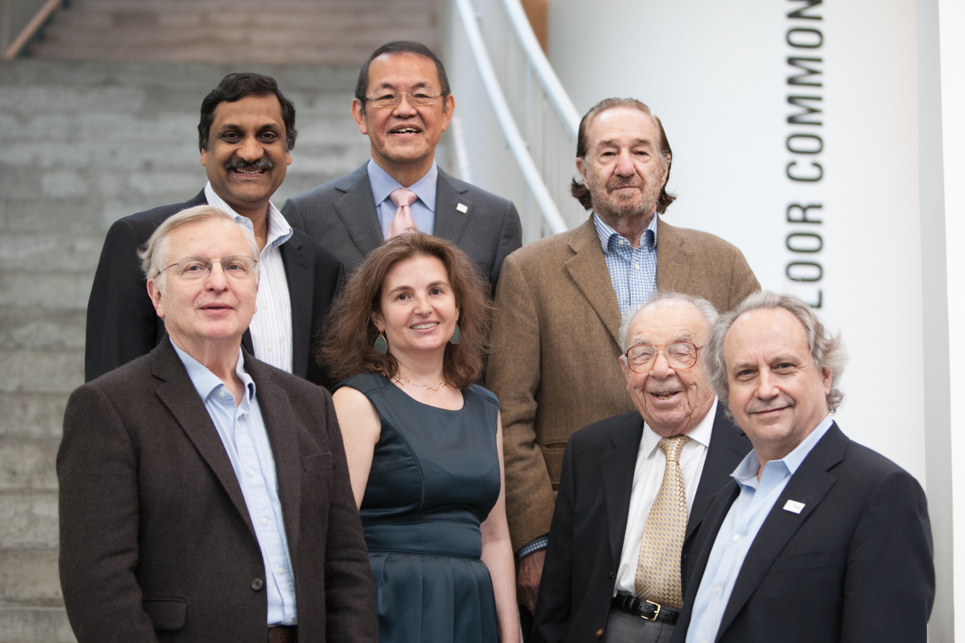 Group shot of CSAIL's former and current faculty directors standing together on a white staircase from 2013.