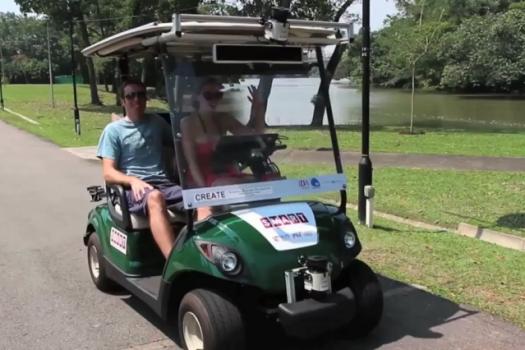 Autonomous vehicles share sidewalk space with pedestrians in six-day trial in Singaporean public garden.