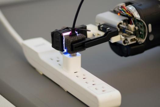 Equipped with a novel optical sensor, a robot grasps a USB plug and inserts it into a USB port.