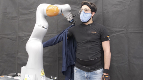 Robots dress humans without the full picture