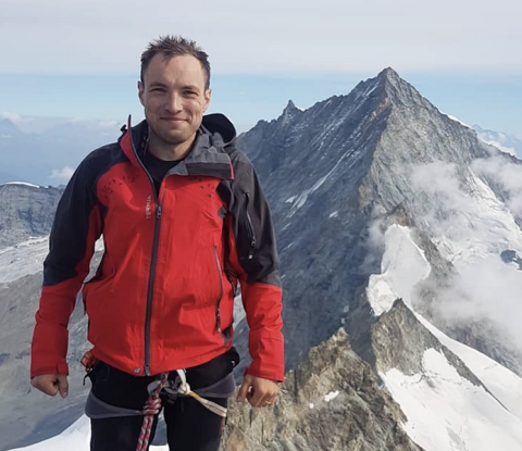 Late MIT scientist Octavian-Eugen Ganea stands on a mountain