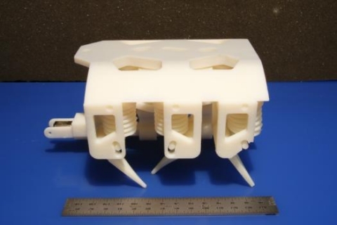 This 3-D hexapod robot moves via a single motor, which spins a crankshaft that pumps fluid to the robot’s legs. Besides the motor and battery, every component is printed in a single step with no assembly required.