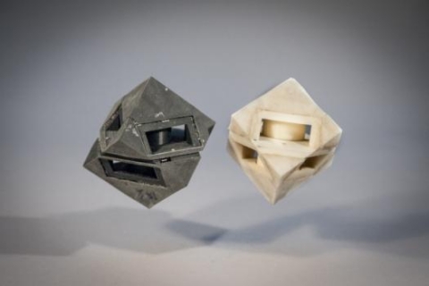 MIT researchers outfitted their cube robot with shock-absorbing “skins” (left) that transfer less than half of the energy that would normally be transferred to the ground.
